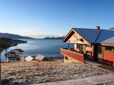 a house on the shore of a body of water at Apartment Bakkafall by Interhome in Svortevik