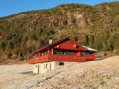 a red house with a balcony on top of a hill at Apartment Bakkafall by Interhome in Svortevik