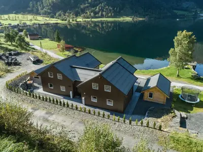 an aerial view of a house with a lake at Holiday Home Kaja by Interhome in Vik