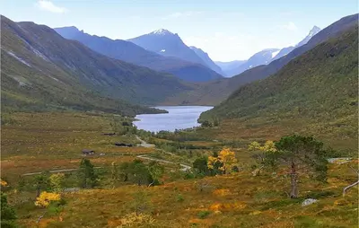 a view of a valley with a lake and mountains at Nice Home In Straumgjerde in Riksem