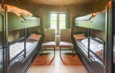a room with three bunk beds and a window at Pet Friendly Home In Trysil With Wifi in Trysil