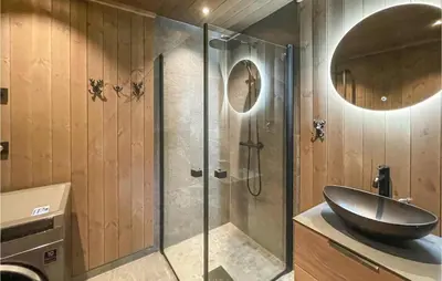 a bathroom with a sink and a glass shower at Pet Friendly Home In Trysil With Wifi in Trysil