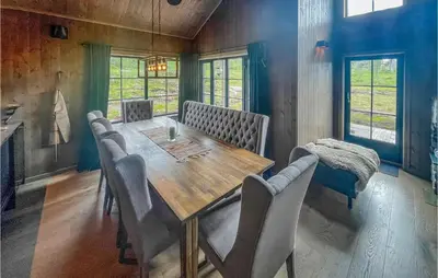 a dining room with a wooden table and chairs at Pet Friendly Home In Trysil With Wifi in Trysil