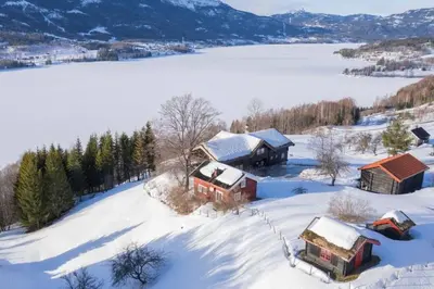 an aerial view of a house in the snow at « SoFly Cottage », le charme pur in Noresund