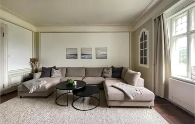 a living room with a couch and a table at Gorgeous Home In Koppang With Sauna in Koppang