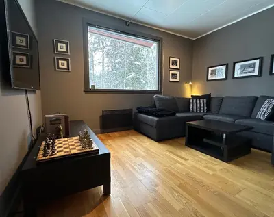 a living room with a couch and a chess board at Hemsedal 200m2 /5 sov/10 senger/2 familier in Torset