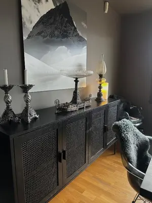 a black cabinet in a room with a picture on the wall at Hemsedal 200m2 /5 sov/10 senger/2 familier in Torset