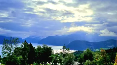 a view of a body of water and mountains at Panorama view in Stranda