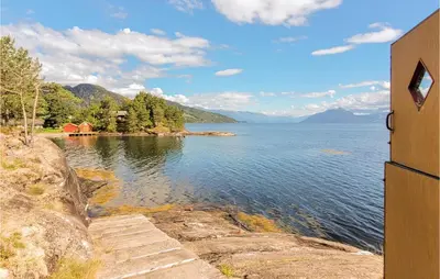 a view of a body of water with a house at Amazing Home In Tørvikbygd With Wifi in Tyrvikbygd