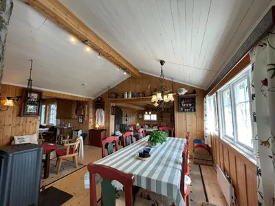 a dining room with a table and chairs at Snikkerplassen - cabin with amazing view and hiking opportunities in Sør-Fron