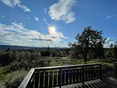 a wooden bench sitting on top of a hill at Elveseter - log cabin with an amazing view in Venabygd