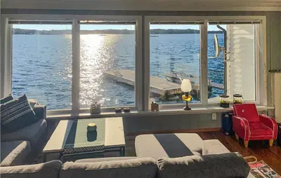 a living room with a view of the water at Stunning Home In Fitjar With Wifi in Fitjar