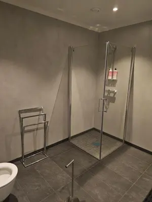 a bathroom with a shower and a toilet at Panorama view in Stranda