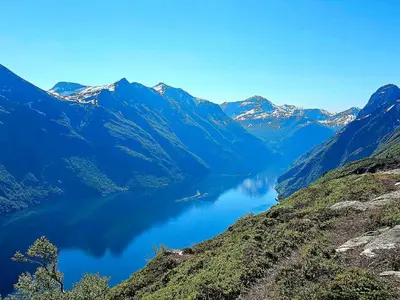 a view of a mountain lake in the mountains at Panorama view in Stranda
