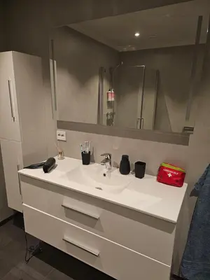 a bathroom with a white sink and a mirror at Panorama view in Stranda