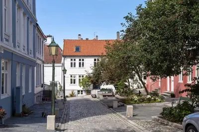 a street in a city with buildings and a street light at Dinbnb Apartments I New 2023 I 600m to Bryggen in Bergen