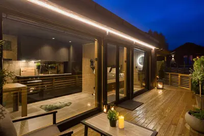 a balcony of a house with a wooden deck at Hide Hut - Amazing view 50 min from Oslo in Stange