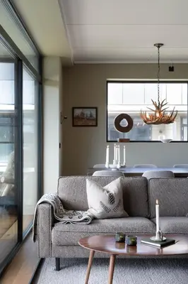 a living room with a couch and a table at Spacious and modern apartment in the heart of Geilo, perfect year round! in Geilo