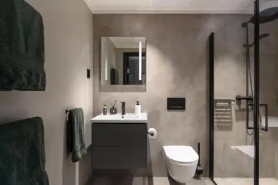 a bathroom with a sink and a toilet and a shower at Spacious and modern apartment in the heart of Geilo, perfect year round! in Geilo