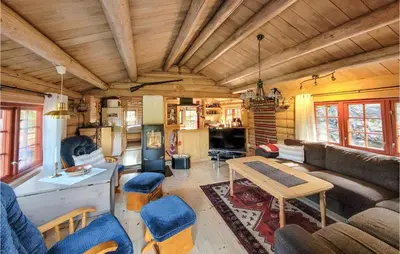 a living room with a couch and a table at 3 Bedroom Stunning Home In Vossestrand in Vossestrand