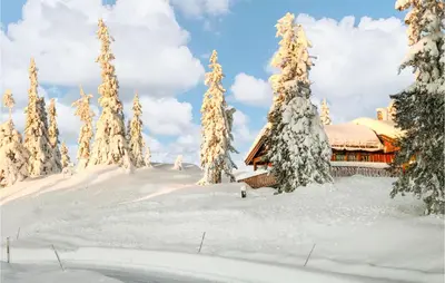 a cabin in the snow with snow covered trees at Lovely Home In Veggli With Kitchen in Veggli