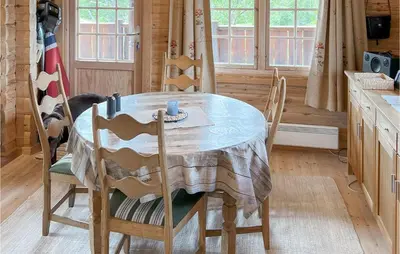 a table and chairs in a kitchen with a table and a table at Lovely Home In Veggli With Kitchen in Veggli