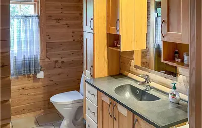 a bathroom with a toilet and a sink at Lovely Home In Veggli With Kitchen in Veggli