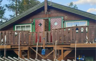 a log cabin with a porch and a deck at 1 Bedroom Amazing Apartment In Trysil in Trysil
