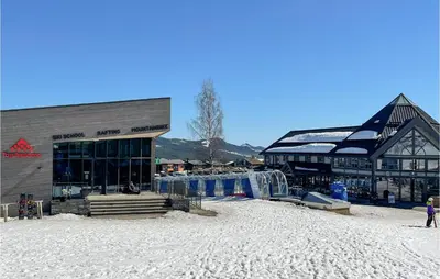 a group of buildings with snow on the ground at 1 Bedroom Amazing Apartment In Trysil in Trysil