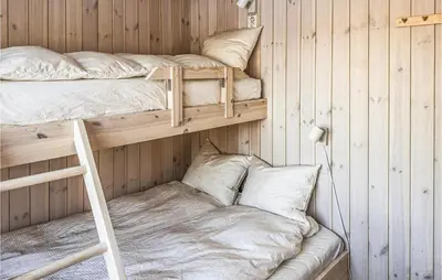 a room with two bunk beds and a pillow at 3 Bedroom Amazing Home In Tuddal in Tuddal