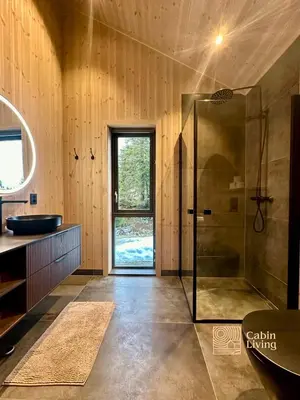 a bathroom with a shower and a sink at Unique new cabin by Hafjell & Skei with stunning view in Tretten