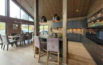 a dining room with a table and chairs at Awesome Home In Norheimsund With Sauna in Norheimsund