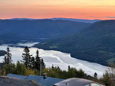 a view of a river in a valley at sunset at Ny leilighet på Norefjell - ski in/out in Noresund