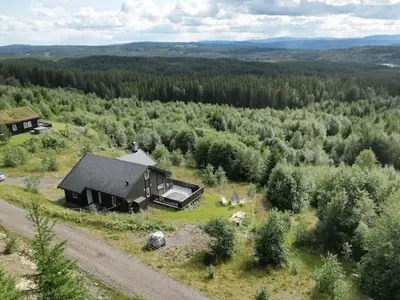 an aerial view of a house in the middle of a forest at 4 star holiday home in Fall-By Traum in Raufoss
