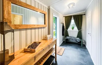 a room with a counter and a mirror on the wall at Beautiful Home In Sjusjøen With Kitchen in Sjusjøen