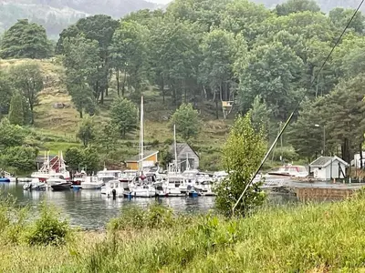 a bunch of boats are docked in a harbor at 6 person holiday home in Bjoa-By Traum in Utbjoa