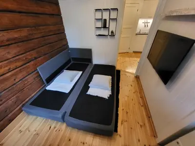 an overhead view of a room with a bed and a tv at Mars Modern and Cozy Apartment in the centre, Free Parking in Trondheim
