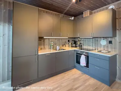 a kitchen with gray cabinets and blue appliances at Hafjelltunet in Hafjell