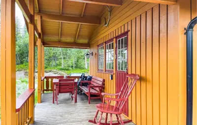 a porch with chairs and a table on it at Lovely Home In Eggedal With Wifi in Eggedal