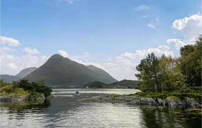a view of a river with a mountain in the background at Beautiful Home In Tustna With Wifi in Gullstein