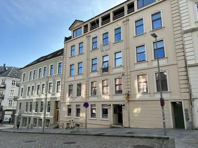 a large building on the corner of a street at Vestre Torggaten 20 in Bergen
