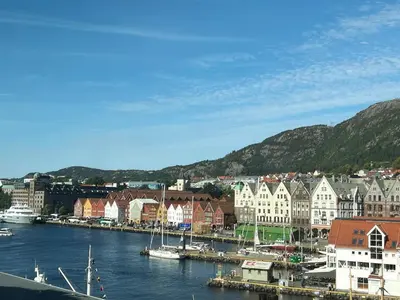a town with a harbor with boats in the water at Vestre Torggaten 20 in Bergen