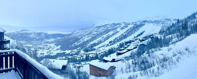 a snow covered mountain with a train on it at Skarsnuten Fjellandsby 23, Hemsedal, Ski-in/out in Hemsedal