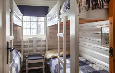 a bedroom with bunk beds in a house at Beautiful Home In Bjorli in Bjorli
