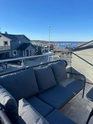 a couch sitting on the roof of a house at Eksluzywny apartament w zaciszu in Kristiansund