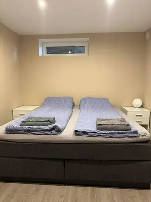 a bed in a bedroom with two pillows on it at A Cozy Place To Stay Over in Tysvær