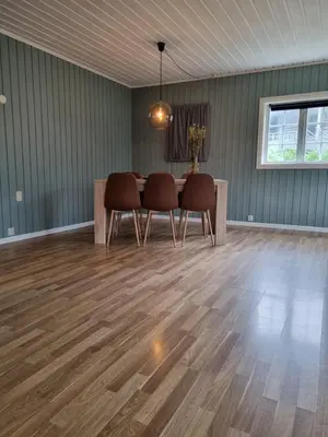 a dining room with a table and chairs at Stor leilighet med 4 senger sentralt i Førde in Førde