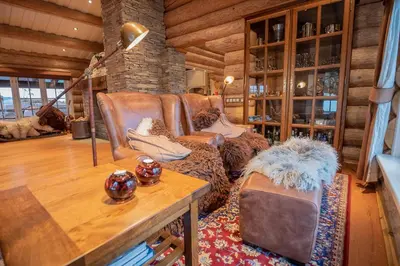 a living room with a couch and a table at Chalet De Luxe 518 in Trysil