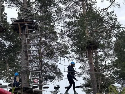 a man walking in front of a tree at Mailatunet - Vestlia resort in Geilo