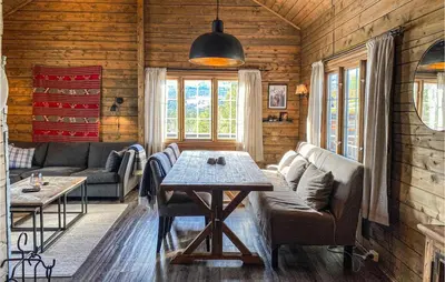 a living room with a couch and a table at Gorgeous Home In Bjorli With Wifi in Bjorli